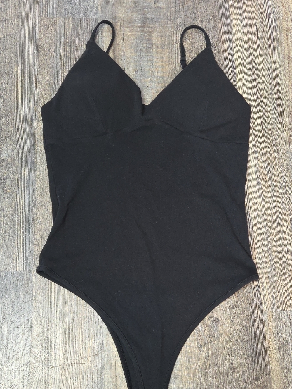 Sleek Black V-Neck Bodysuit with Adjustable Straps